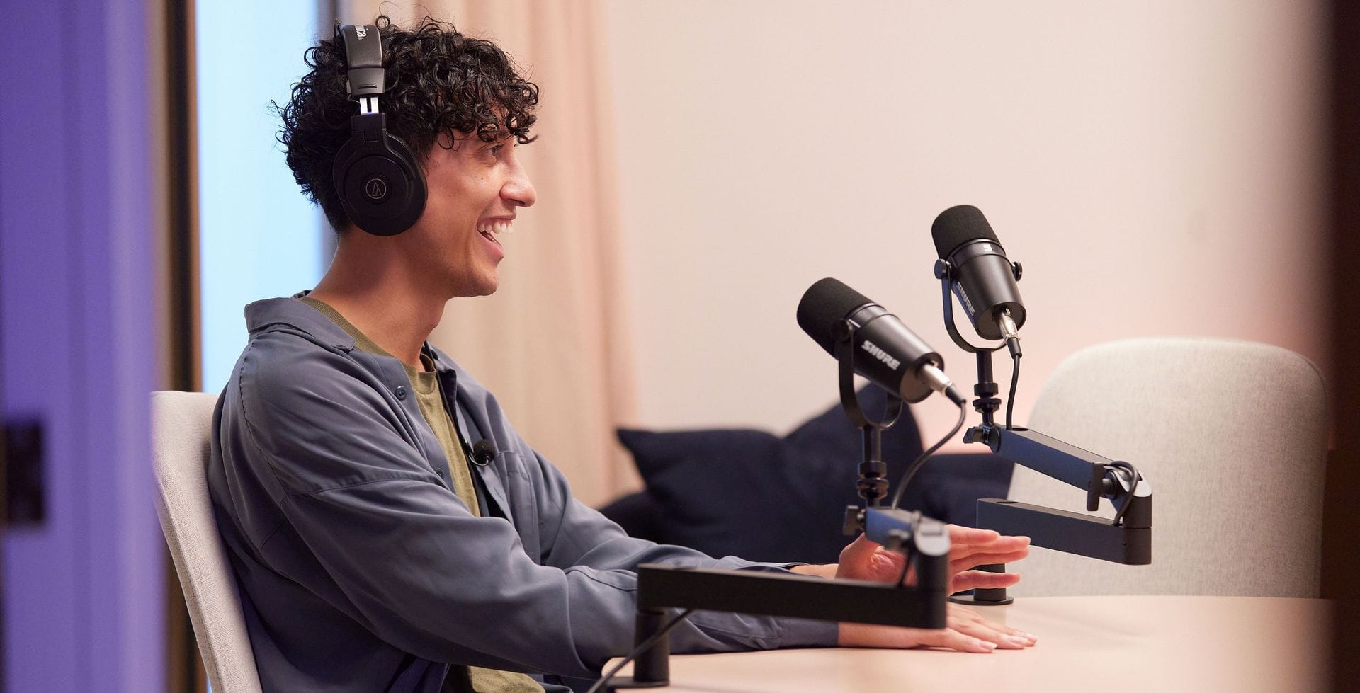 Male podcaster behind the microphone